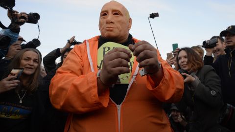 A protester wearing a rubber Putin mask in St. Petersburg on Saturday.