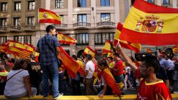 Protesters hold Spanish flags during a demonstration called by "Societat Civil Catalana" (Catalan Civil Society) to support the unity of Spain on October 8, 2017 in Barcelona.
Ten of thousands of flag-waving demonstrators packed central Barcelona to rally against plans by separatist leaders to declare Catalonia independent following a banned secession referendum. Catalans calling themselves a "silent majority" opposed to leaving Spain broke their silence after a week of mounting anxiety over the country's worst political crisis in a generation.
 / AFP PHOTO / PAU BARRENA        (Photo credit should read PAU BARRENA/AFP/Getty Images)