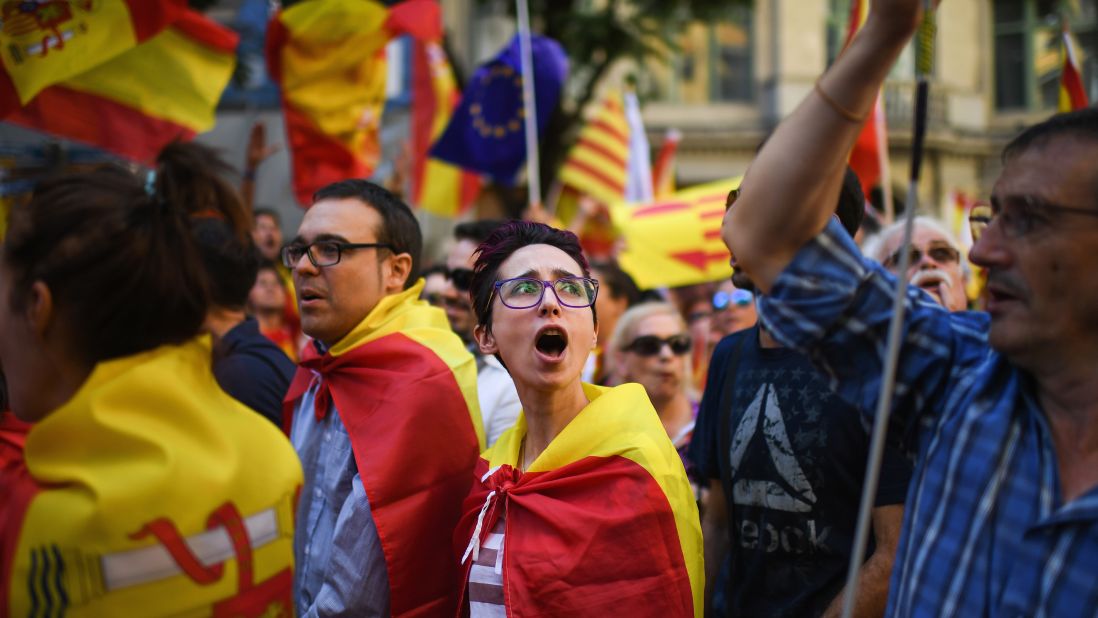 Protesters march through Barcelona during a demonstration to support the unity of Spain on October 8. A bitterly contested independence referendum on October 1 has stoked fierce divisions in the northeastern region of Catalonia and across Spain. 