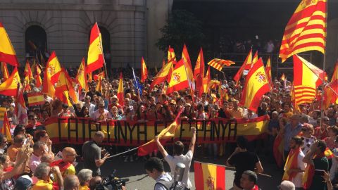 Protesters hold a banner that reads "Catalonia is Spain" at the pro-unity rally in Barcelona on Sunday. 