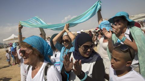 Palestinian and Israeli women take part in a peace march near the Dead Sea.