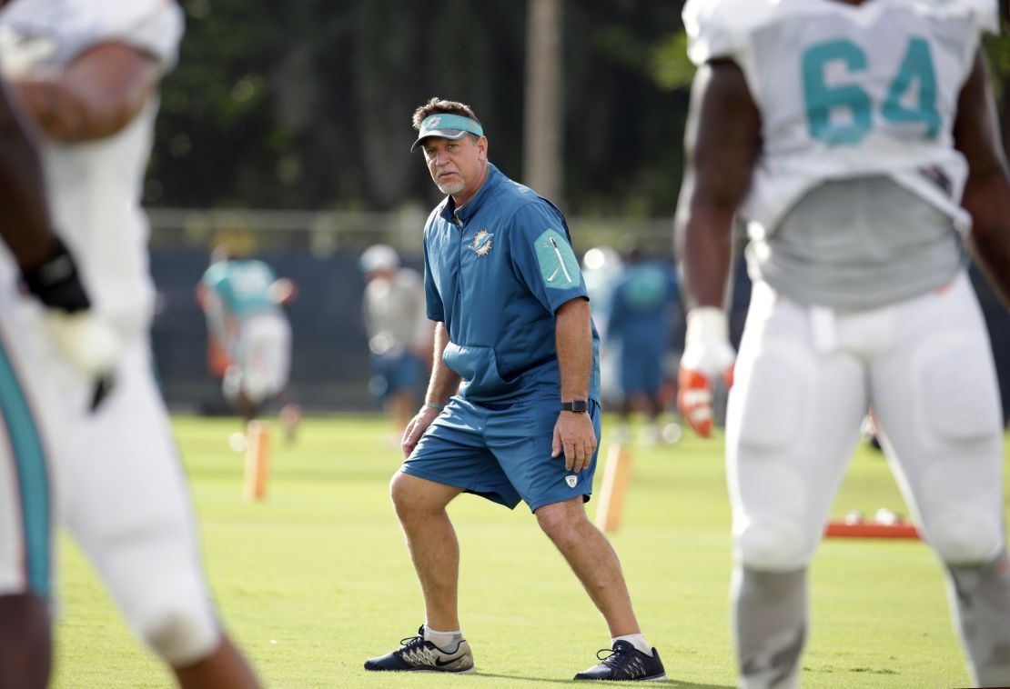 Miami Dolphins offensive line coach Chris Foerster watches as players do drills during a training camp in Davie, Florida.