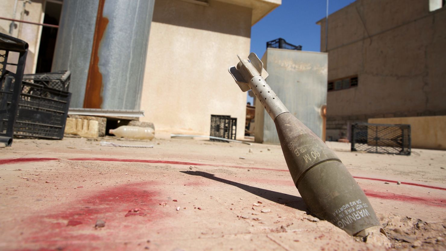 A 60mm mortar sits stuck in a roof in Mosul, Iraq, on September 11.