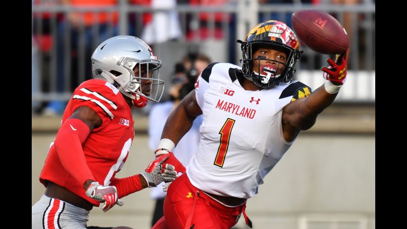 D.J. Moore of the Maryland Terrapins reaches but misses the catch on a fourth down pass attempt in front of Kendall Sheffield of the Ohio State Buckeyes on Saturday, October 7, in Columbus, Ohio.