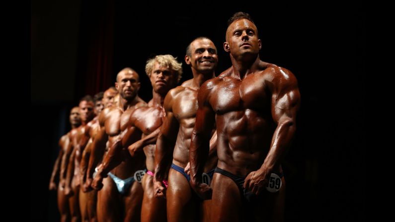 Competitors pose on stage during the Victorian Bodybuilding Championship on Sunday, October 8, in Melbourne, Australia.