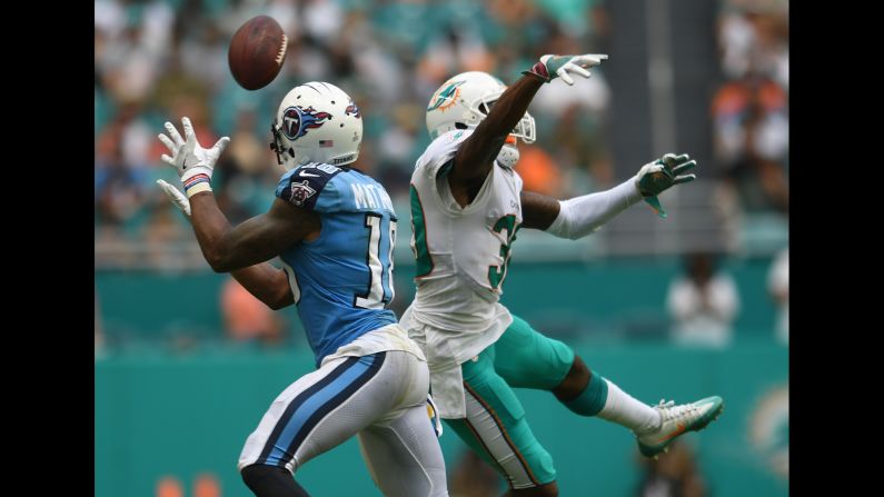 Miami Dolphins cornerback Cordrea Tankersley, right, deflects a pass intended for Tennessee Titans wide receiver Rishard Matthews on Sunday, October 8. The Dolphins won, 16-10. <a href="index.php?page=&url=http%3A%2F%2Fwww.cnn.com%2F2017%2F10%2F09%2Fsport%2Fmiami-dolphins-ol-coach-resigns%2Findex.html" target="_blank">Miami Dolphins' offensive line coach resigns</a>