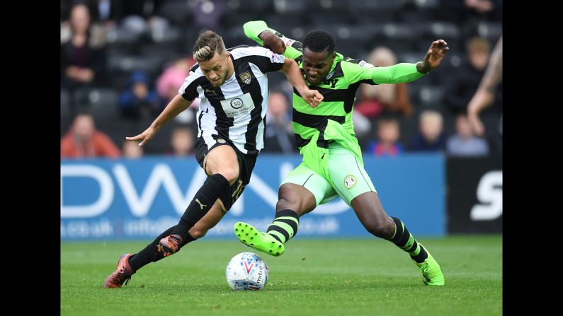 Jorge Grant of Notts County, left, battles with Dale Bennett of Forest Green Rovers during the Sky Bet League Two match on Saturday, October 7, in Nottingham, England.