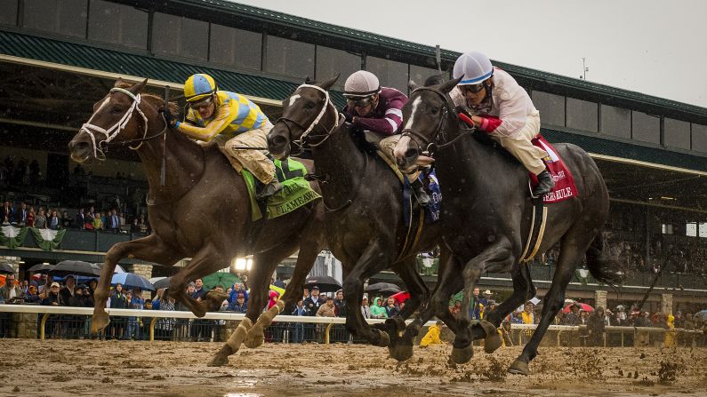 Flameaway, left, with jockey Julien Leparoux aboard, gets up to beat Tap Daddy, center, with Florent Geroux, as well as Tigers Rule and jockey Miguel Mena in The Dixiana Bourbon Stakes at Keeneland Race Course on Sunday, October 8, in Lexington, Kentucky.