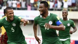 Nigeria's Mikel John Obi (C) celebrates with teammates William Ekong (L) and Odion Ighalo after scoring a goal during the 2018 FIFA World Cup qualifying football match between Nigeria and Cameroon at Godswill Akpabio International Stadium in Uyo, southern Nigeria, on September 1, 2017. / AFP PHOTO / PIUS UTOMI EKPEI        (Photo credit should read PIUS UTOMI EKPEI/AFP/Getty Images)