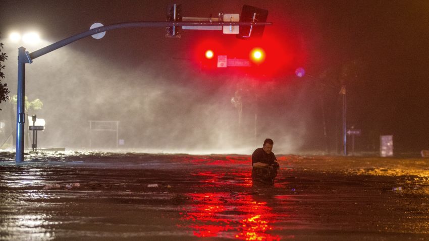 BILOXI,MS-OCTOBER 8, 2017:  Lanny Dean, from Tulsa, Oklahoma, takes video as he wades along a flooded Beach Boulevard next to Harrahs Casino as the eye of Hurricane Nate pushes ashore in Biloxi, Mississippi October 8, 2017.  Hurricane Nate flooded the parking garage and first floors of Golden Nugget, Harrahs and other casinos as it made a second landfall on the Mississippi coast as a category 1 storm. (Photo by Mark Wallheiser/Getty Images)