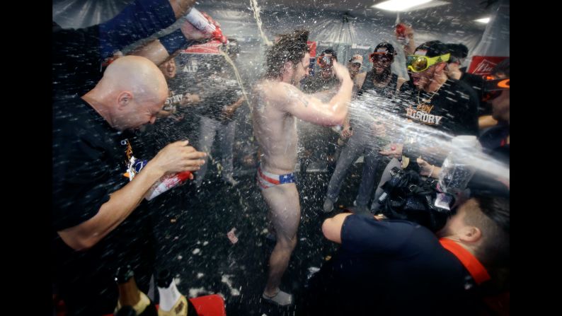 Houston Astros' Josh Reddick is sprayed with champagne after the team defeated the Boston Red Sox 5-4 in Game 4 of the American League Division Series on Monday, October 9 in Boston. The Astros advance to the American League Championship Series.