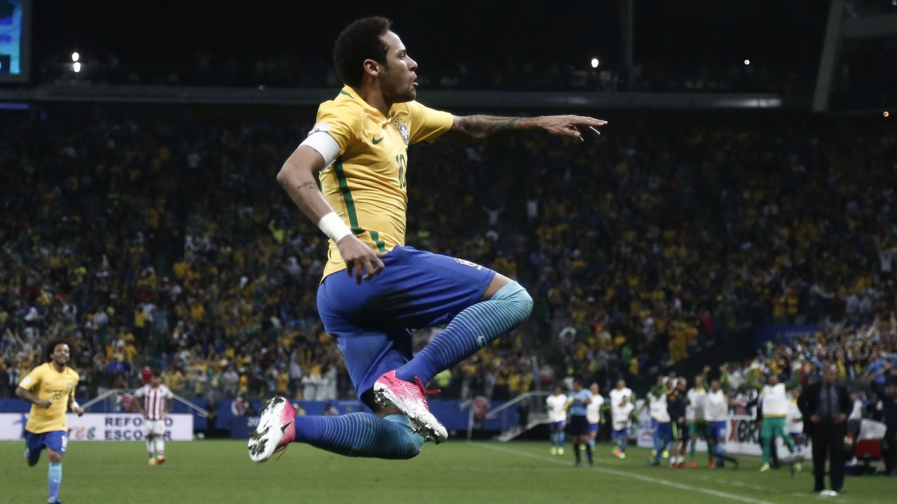 TOPSHOT - Brazil's forward Neymar celebrates after scoring against Paraguay during their 2018 FIFA World Cup qualifier football match in Sao Paulo, Brazil on March 28, 2017. / AFP PHOTO / Miguel SCHINCARIOL        (Photo credit should read MIGUEL SCHINCARIOL/AFP/Getty Images)