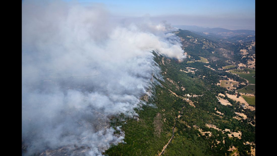 Smoke rises in the hills east of Napa on October 9.