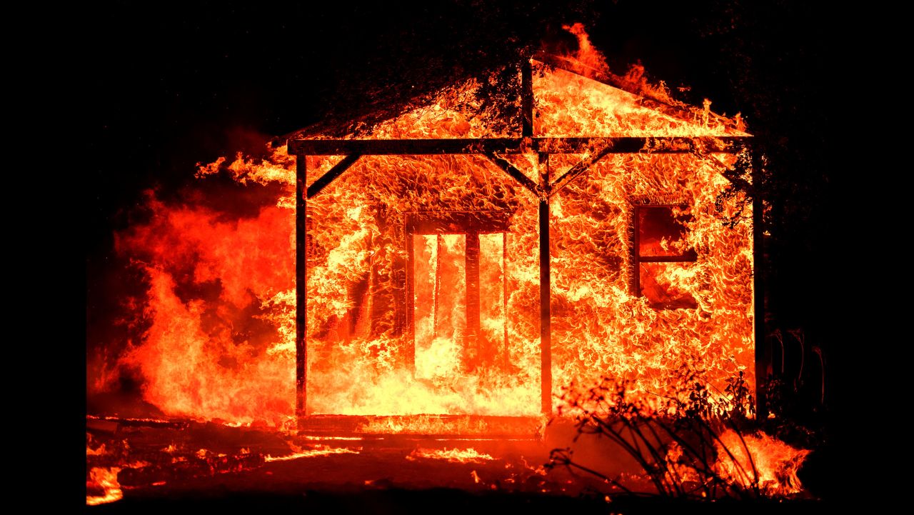 Flames overtake a structure in the Napa wine region on October 9.