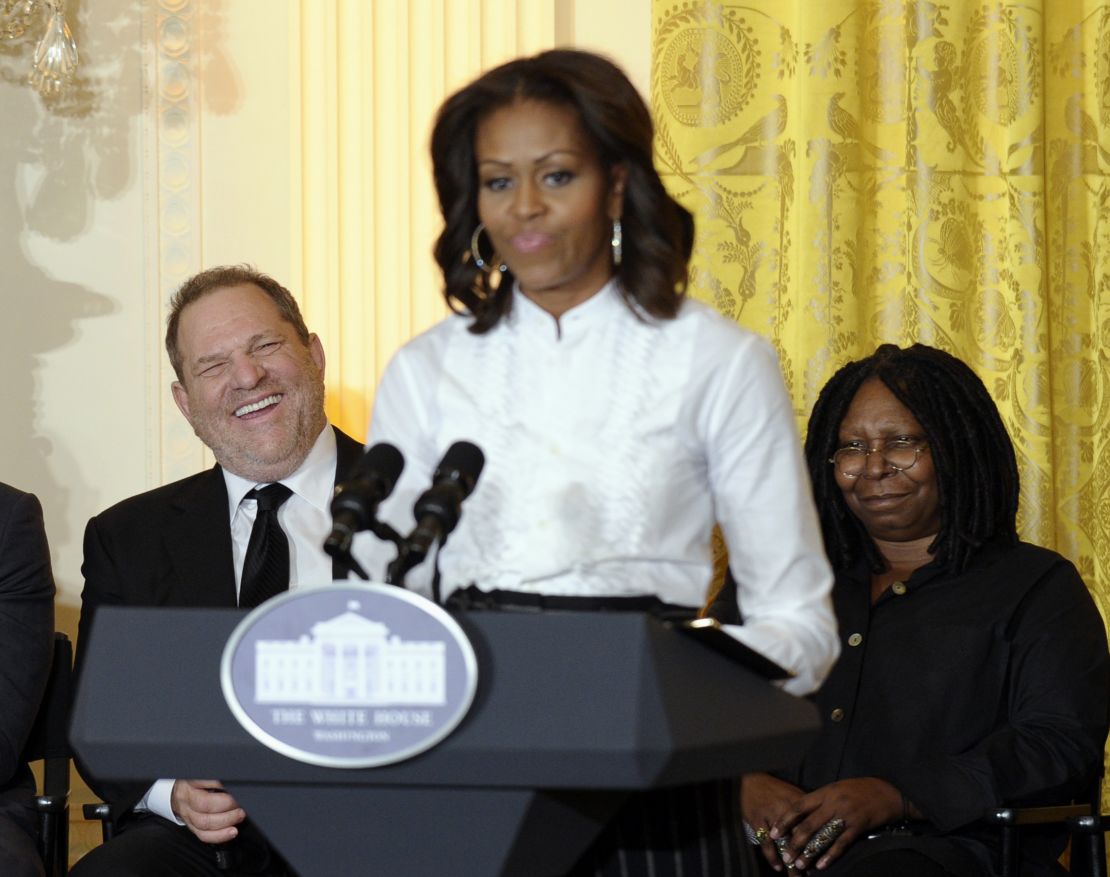 Movie mogul Harvey Weinstein, left, and Academy Award winning actress Whoopie Goldberg, listen as first lady Michelle Obama speaks in the East Room of the White House in Washington, Friday, Nov. 8, 2013, at a workshop for high school students from Washington, New York and Boston about careers in film. 