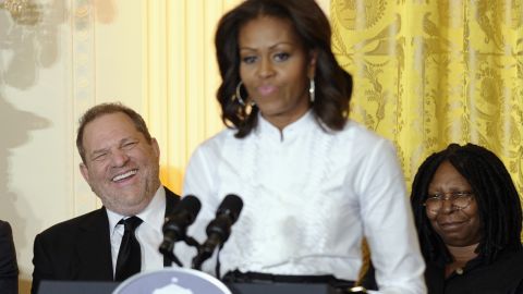 Movie mogul Harvey Weinstein, left, and Academy Award winning actress Whoopie Goldberg, listen as first lady Michelle Obama speaks in the East Room of the White House in Washington, Friday, Nov. 8, 2013, at a workshop for high school students from Washington, New York and Boston about careers in film. 