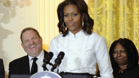 Movie mogul Harvey Weinstein, left, and Academy Award winning actress Whoopie Goldberg, listen as first lady Michelle Obama speaks in the East Room of the White House in Washington, Friday, Nov. 8, 2013, at a workshop for high school students from Washington, New York and Boston about careers in film.