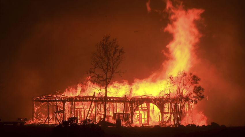 The Historic Round Barn burns, Monday October 9, 2017, in Santa Rosa, Calif. More than a dozen wildfires whipped by powerful winds been burning though California wine country. The flames have destroyed at least 1,500 homes and businesses and sent thousands of people fleeing.