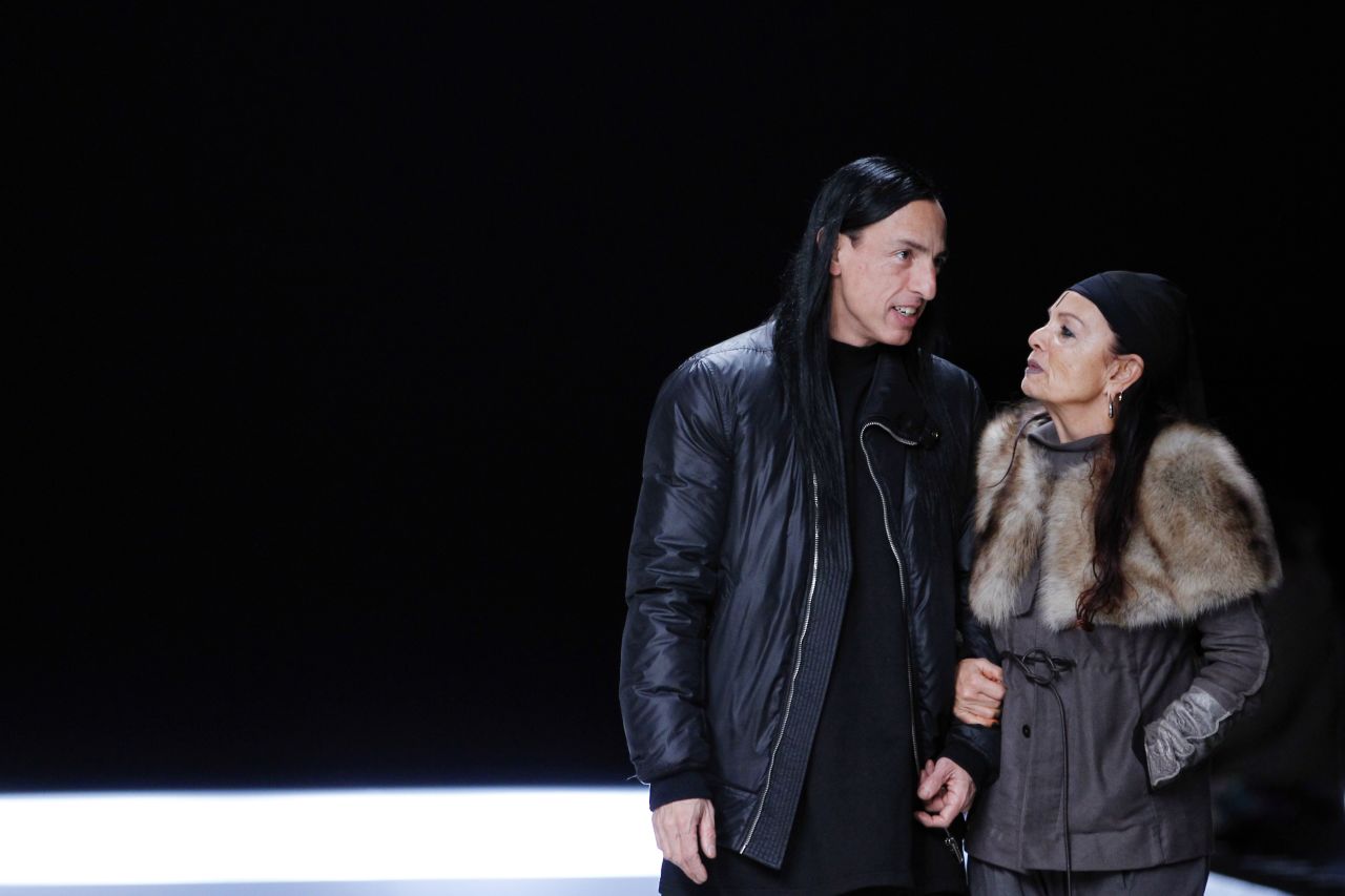 Fashion designer Rick Owens speaks with Michèle Lamy before the start of his show presenting his Autumn/Winter 2012-2013 ready-to-wear men's fashion collection. Credit: Alexander Klein