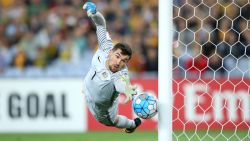 SYDNEY, AUSTRALIA - OCTOBER 10: Mathew Ryan of Australia saves a goal during the 2018 FIFA World Cup Asian Playoff match between the Australian Socceroos and Syria at ANZ Stadium on October 10, 2017 in Sydney, Australia.  (Photo by Cameron Spencer/Getty Images)