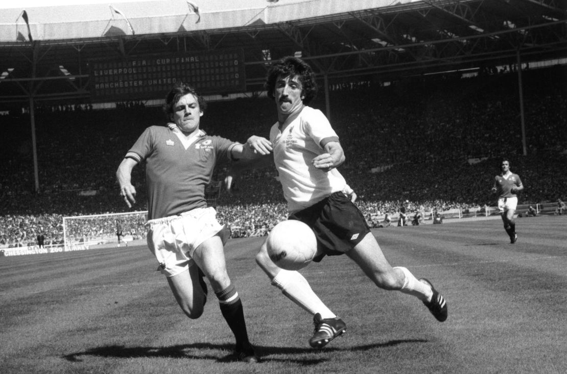 Manchester United's Steve Coppell (left) attempts to tackle Liverpool's David Johnson during the 1977 FA Cup Final at Wembley Stadium.