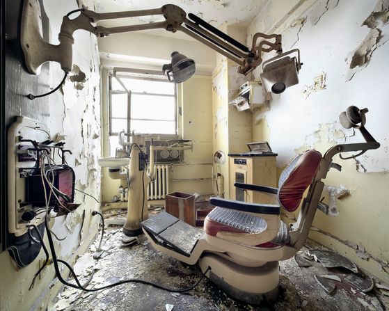 A dentist's chair sits abandoned in one of the most recognizable skyscrapers in the Detroit skyline, the Broderick Tower. Opened in 1928, it was favored by medical practitioners until it was seized by the state in 1981 due to unpaid taxes. It sat empty for about 30 years before a $50-million renovation plan started in 2010, when this photo was taken. It reopened in 2012 as a <a  target="_blank" target="_blank">luxury condo.</a>