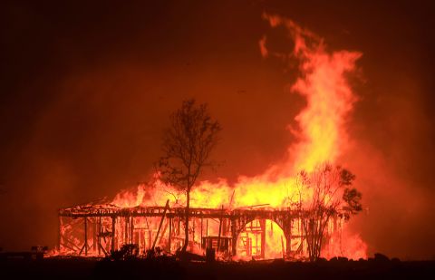 A historic barn burns in Santa Rosa on October 9.
