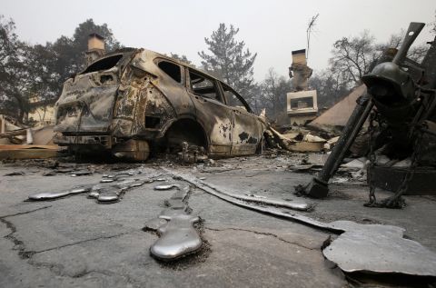 Puddles of melted metal trail away from a burned-out car near Napa on October 10. 