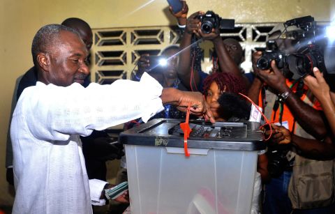 Liberian presidential candidate Alexander Cummings casts his ballot. He is one of 20 candidates vying for the presidency. <br />Credit: Getty images