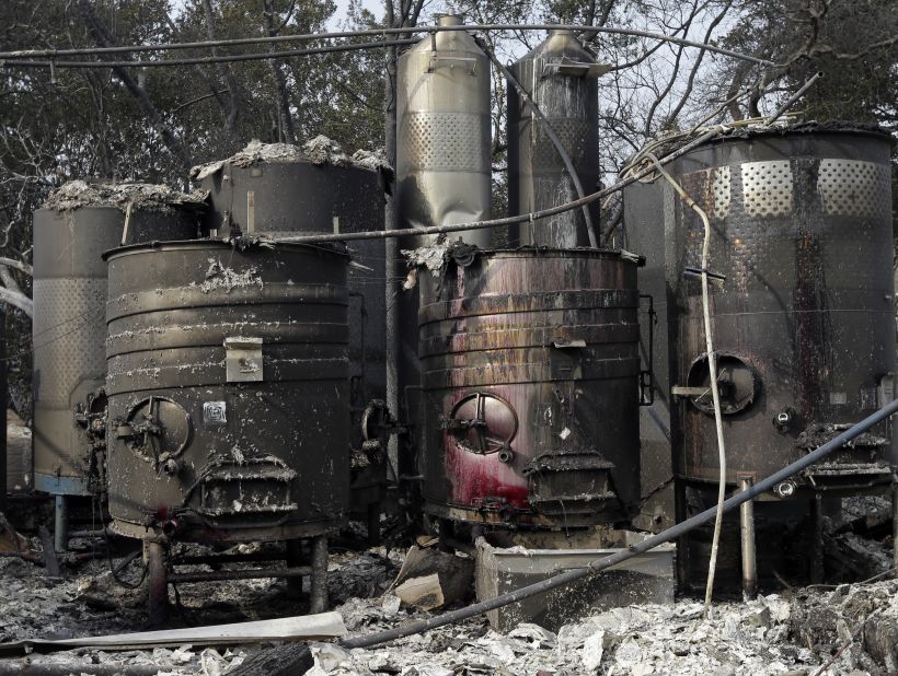 Damaged winemaking vats and tanks stand in ashes and debris at the Paradise Ridge Winery in Santa Rosa.