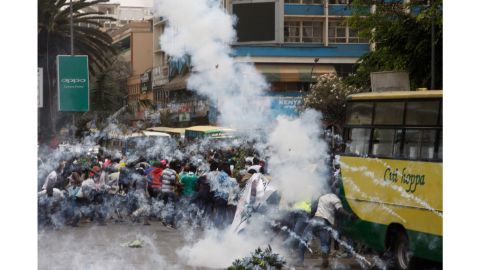 Riot police use tear gas on opposition supporters during an October 11 protest in Nairobi.
