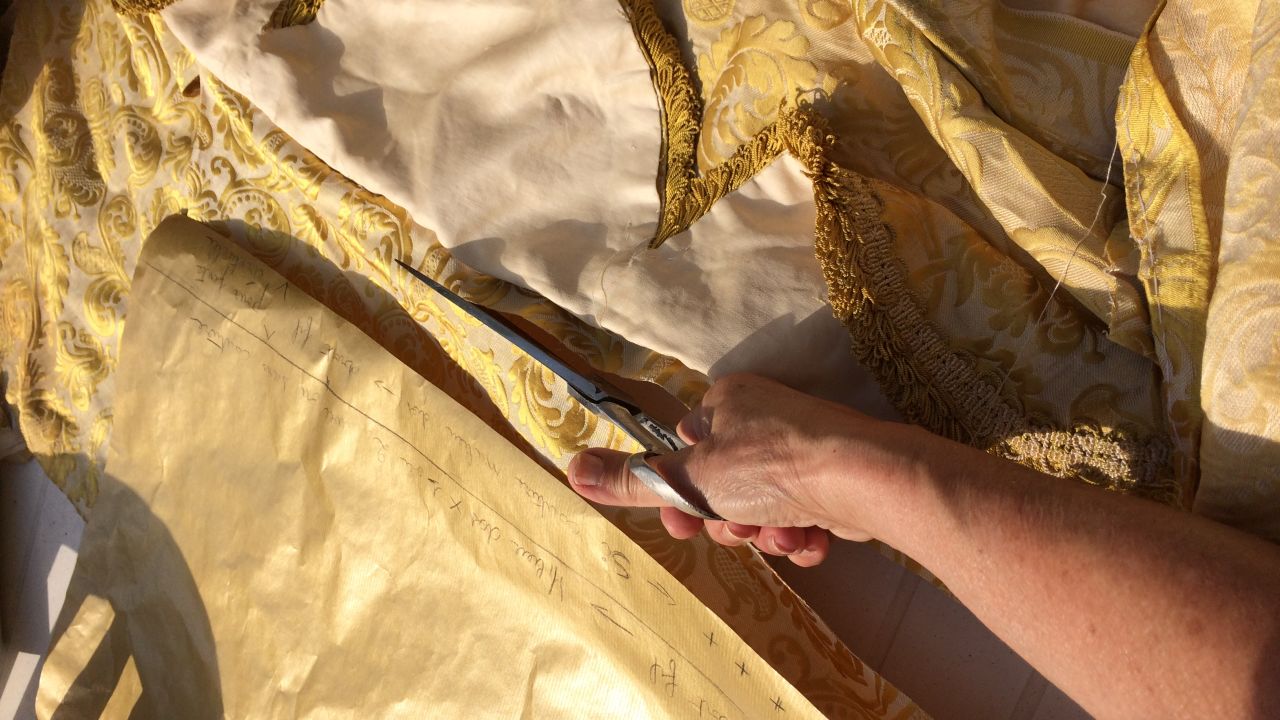 Hartmann transforms old hotel curtains into clothes.