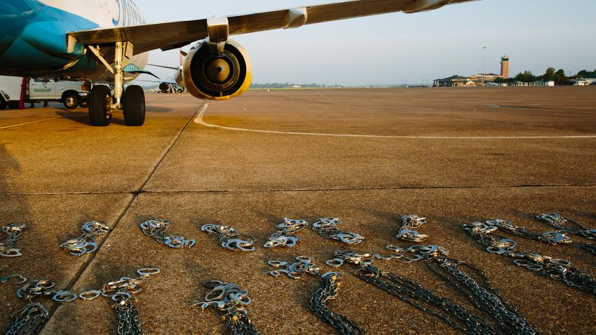 The airport in Alexandria, Louisiana, is one of five hubs for ICE Air. Before deportation flights take off, officers lay out shackles on the tarmac.