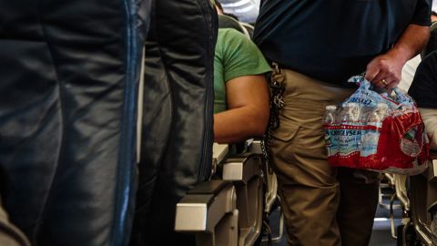 Deportees on the flight receive sandwiches, granola bars and bottled water.