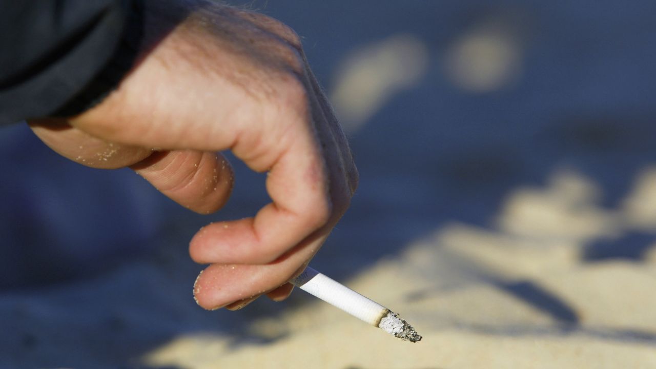 SYDNEY - MAY 19:  A smoker enjoys a cigarette on Bondi Beach May 19, 2004 in Sydney, Australia. Waverley Council has passed a motion to investigate the legalities and enforcement of a smoking ban on the Council's beaches, including Bondi, after Manly Council recently outlawed smoking on beaches, making it the first place in the world outside Los Angeles to do so. Data from Clean Up Australia showed 32 billion cigarette butts were dropped in Australia each year, and that at any given time there were 700,000 on Bondi Beach. (Photo by Matt King/Getty Images)