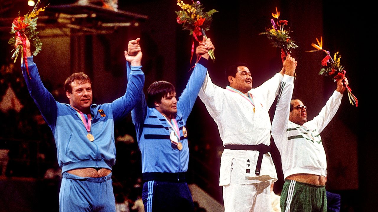 Yamashita stands proudly atop the podium alongside Egypt's Mohamed Ali Rashwan, Romania's Mihail Cioc and Arthur Schnabel of Germany. 