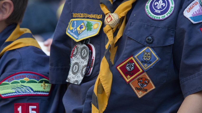 In this June 25, 2016, file photo, Cub Scouts watch a race during the Second Annual World Championship Pinewood Derby in New York's Times Square.  The Boy Scouts of America announced Monday, June 25, 2016, that it will allow transgender children who identify as boys to enroll in its boys only programs.