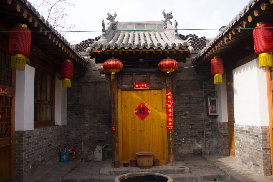 A grand courtyard entrance to one of Pingyao's historic homes.