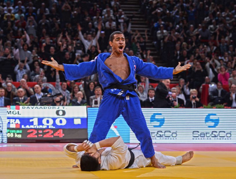 This image is in because I love working in Paris. The iconic Bercy Stadium (as it was called then) has the best public, atmosphere and energy of any tournament in the world. This picture is France's David Larose celebrating after winning the Paris Grand Slam in 2013. I love the story it tells: Larose ecstatic standing over a distraught Davaadorj Tumurkhuleg, the scoreboard reading ippon and the crowd going mad.