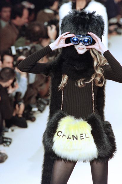German model Claudia Schiffer models a faux-fur creation designed by Karl Lagerfeld for Chanel's Autumn-Winter collection in 1994.