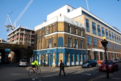South London's landscape has changed dramatically over the past decade thanks to gentrification. Cranes are pictured towering over a former pub in the Deptford neighborhood in 2017.