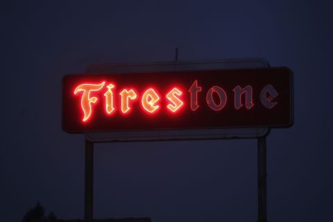 The sign of a Firestone store malfunctions in Santa Rosa on Tuesday, October 10.