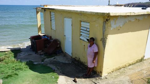 Puerto Rico hurricane victim Irma Torres outside her destroyed home in Yabucoa