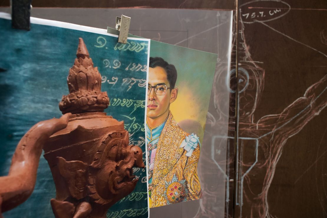 An image of King Bhumibol Adulyadej as a young man on display at a government art studio outside Bangkok.