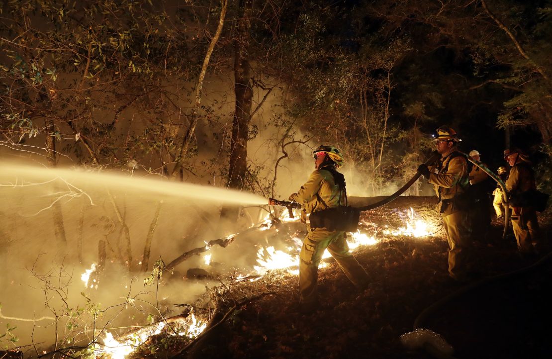Firefighters battle a wildfire Saturday in Santa Rosa