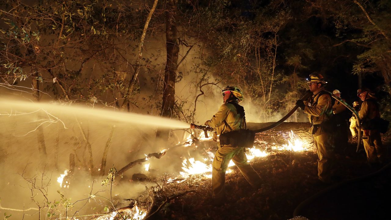 Firefighters battle a wildfire Saturday in Santa Rosa