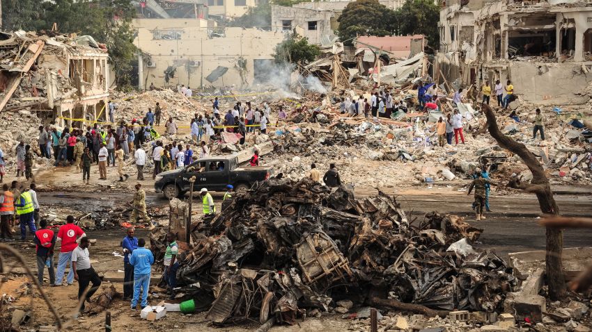 A picture taken on October 15, 2017 shows a general view of the scene of the explosion of a truck bomb in the centre of Mogadishu.
A truck bomb exploded outside a hotel at a busy junction in Somalia's capital Mogadishu on October 14, 2017 causing widespread devastation that left at least 20 dead, with the toll likely to rise.