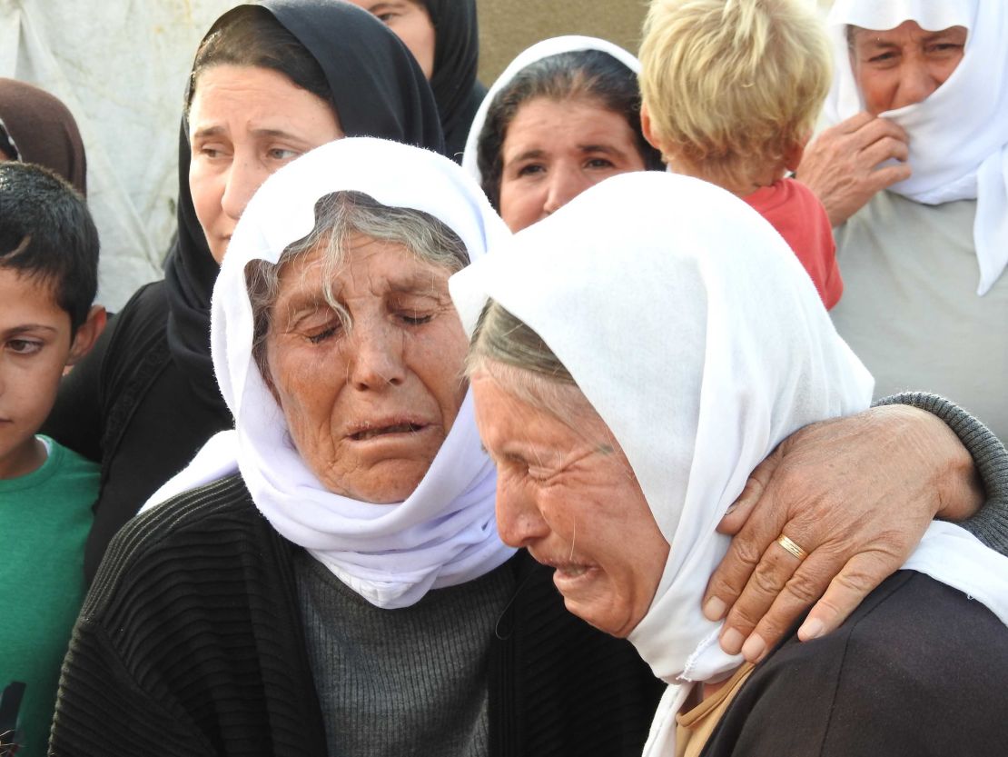 Elderly Yazidi women weep over their sons and daughters who remain in captivity.