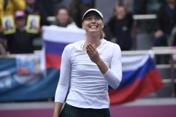 Sharapova celebrates after winning the first tournament since coming back from a drugs ban at the Tianjin Open in China. 
