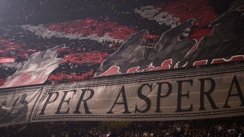 AC Milan supporters deploy a giant banner before the Italian Serie A football match Inter Milan Vs AC Milan on October 15, 2017 at the 'San Siro Stadium' in Milan.  / AFP PHOTO / MARCO BERTORELLO        (Photo credit should read MARCO BERTORELLO/AFP/Getty Images)